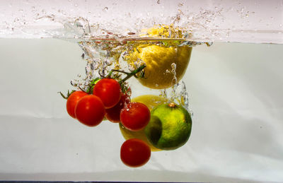 Close-up of cherries in glass