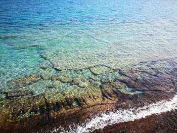 High angle view of surf on beach