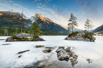 Scenic view of snowcapped mountains against sky during winter
