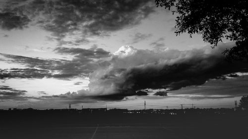 Scenic view of landscape against cloudy sky