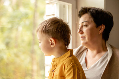 Happy grandmother and grandson enjoy time together. positive middle age woman 