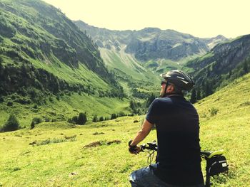Man with bike on mountain