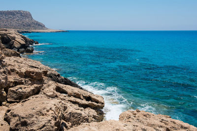 Scenic view of sea against clear blue sky