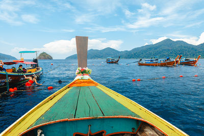 Boats in sea against sky