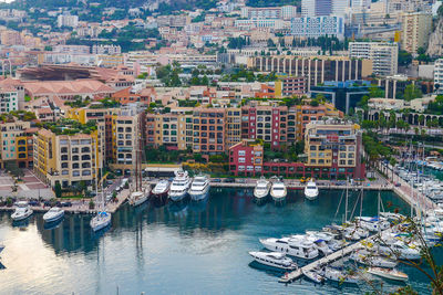 High angle view of marina and buildings in city