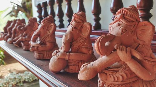 Ganesha sculptures arranged on table