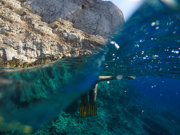 Woman swimming in sea