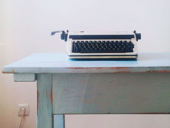 Close-up of vintage typewriter on table