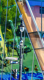 High angle view of people seen through glass