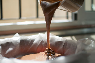 Close-up of hand pouring water