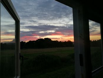 Scenic view of landscape at sunset