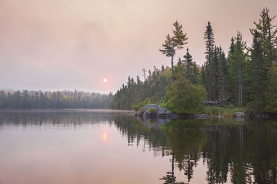 Scenic view of lake against sky during sunset