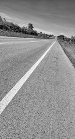 Surface level of road against the sky