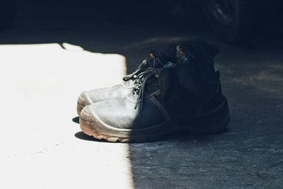 Close-up of shoes on floor