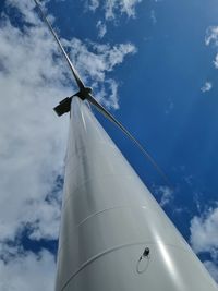 Low angle view of airplane flying against sky