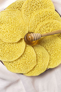 High angle view of yellow bowl on table