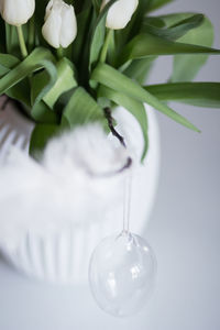 Close-up of white vase and decorations 