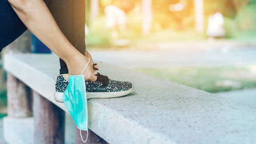 Low section of woman standing on floor
