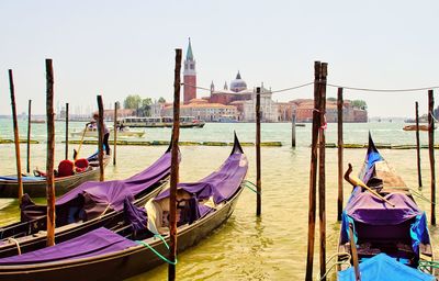 Boats moored in canal