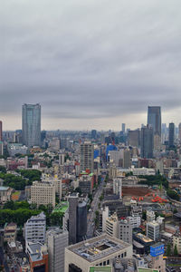 High angle view of buildings in city against sky