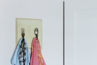 Close-up of clothes hanging on wall
