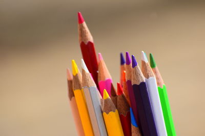 Close-up of colored pencils against white background
