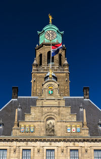 Low angle view of building against blue sky