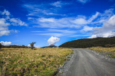 Road amidst landscape against sky