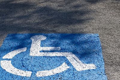 High angle view of arrow symbol on road in city