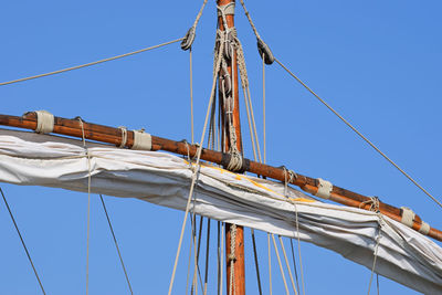 Low angle view of ship mast against sky