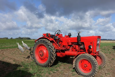 Tractor on field against sky