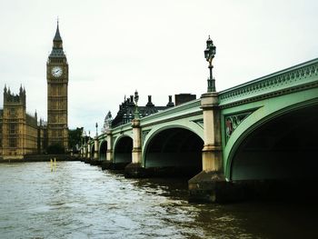 View of bridge over river in city