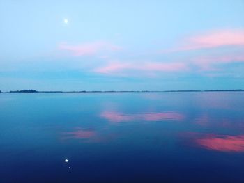 Scenic view of sea against sky at dusk