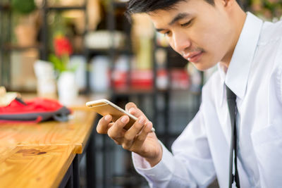 Young man using mobile phone