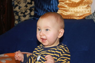 Smiling baby boy at home