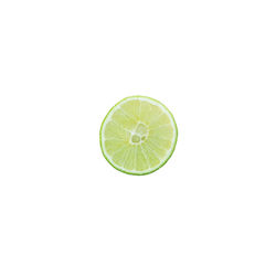 Close-up of lemon slice over white background