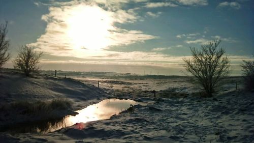 Scenic view of landscape against sky during sunset