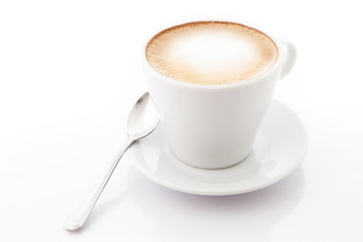 Cup of coffee against white background