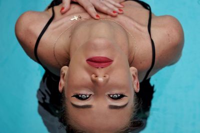 Close-up portrait of young woman in swimming pool