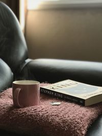 Close-up of coffee cup on table