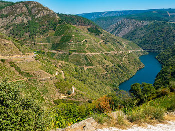 High angle view of land and mountains against sky