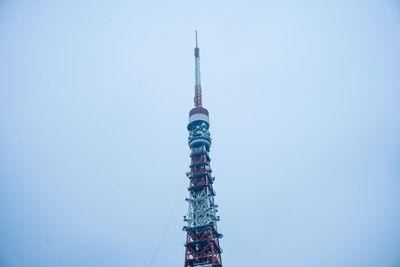 Low angle view of communications tower against sky