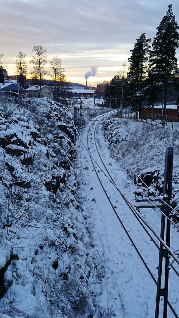 snow, winter, cold temperature, season, weather, sky, frozen, cloud - sky, nature, covering, tranquil scene, tranquility, water, sunset, the way forward, beauty in nature, electricity pylon, tree, transportation, scenics