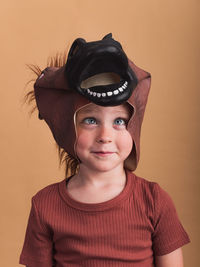 Portrait of a boy against wall