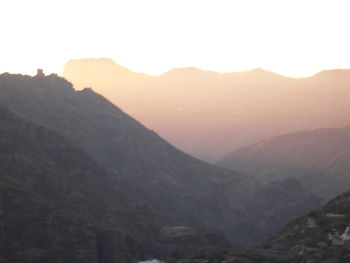 Scenic view of mountains against sky during sunset