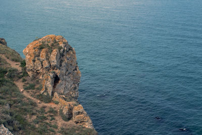 High angle view of rock formation in sea