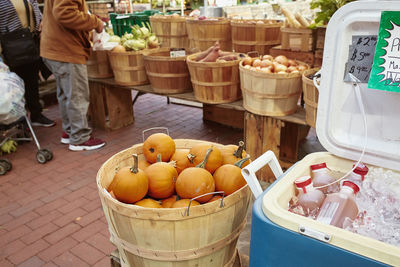 Apple cider and pumpkins for sale at a farmers market in copley square. boston, massachusetts 