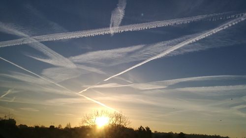 Low angle view of vapor trails in sky