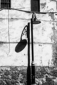 Close-up of shoes on stone wall