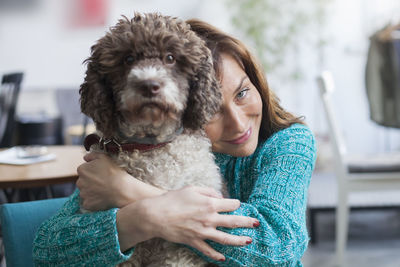Woman with dog at home